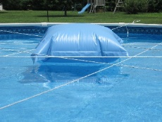 rope draped across pool with float in center